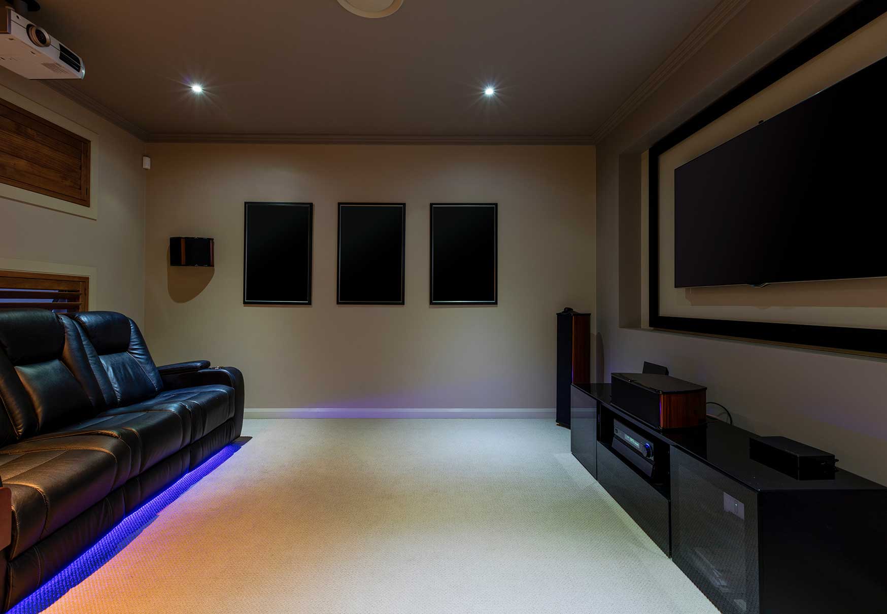 Dedicated home cinema room with projector and TV system Dedicated home cinema room with projector and TV system